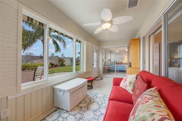 sunroom / solarium with ceiling fan