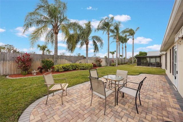 view of patio / terrace with a sunroom