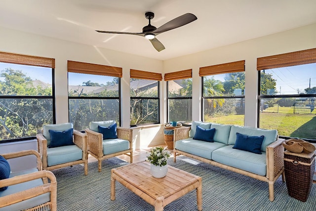 sunroom / solarium featuring ceiling fan and a healthy amount of sunlight