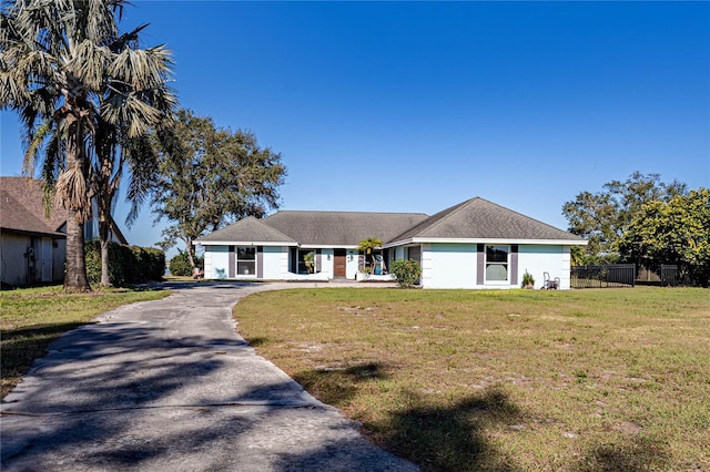 ranch-style house with a front lawn