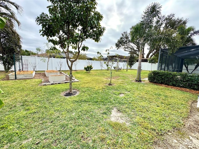 view of yard featuring a lanai