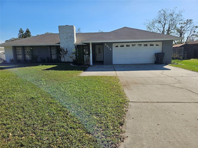 ranch-style house featuring a garage and a front yard