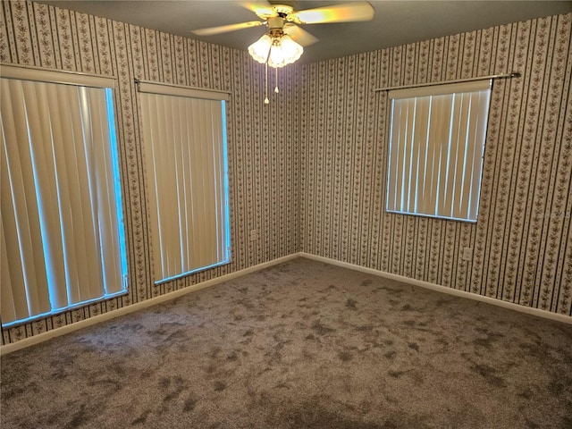 carpeted empty room featuring ceiling fan