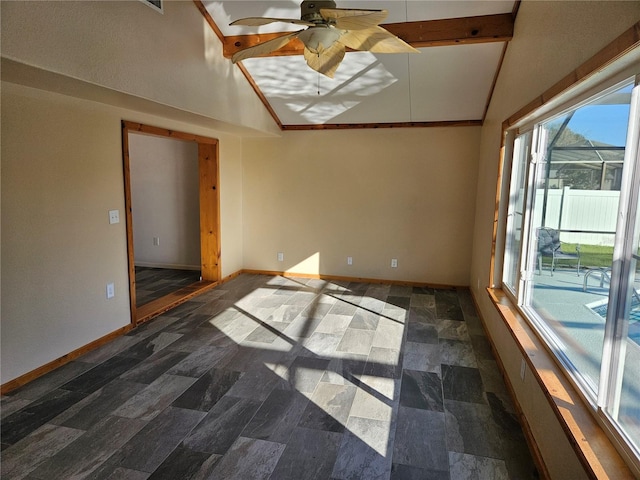 empty room with ceiling fan, beamed ceiling, and high vaulted ceiling