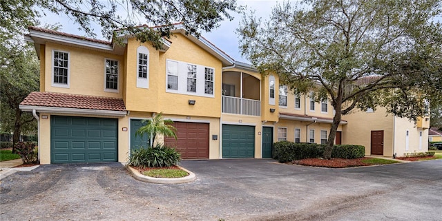 multi unit property featuring a garage