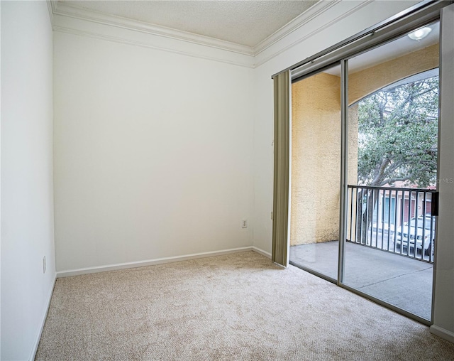 carpeted empty room featuring a textured ceiling