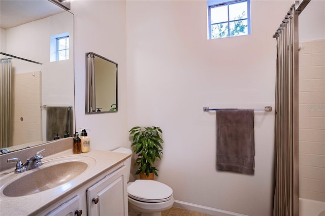 full bathroom featuring toilet, vanity, and shower / tub combo with curtain