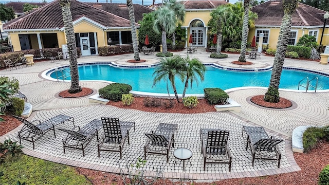 view of pool featuring a patio