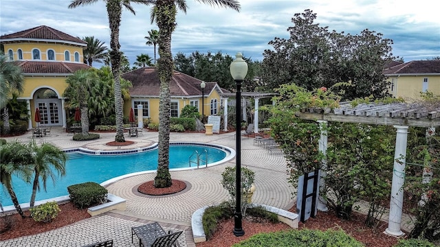 view of swimming pool with a pergola and a patio area