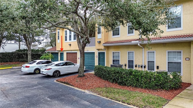 multi unit property featuring a garage