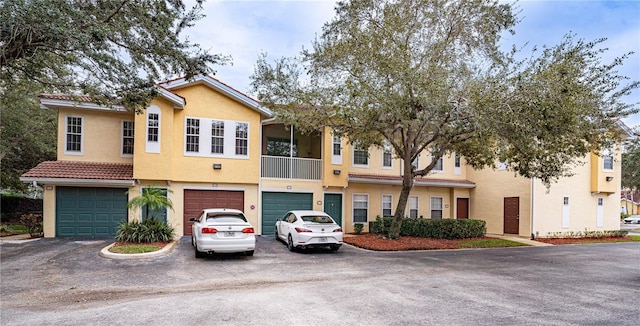 townhome / multi-family property featuring a garage