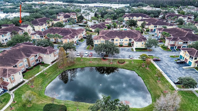 drone / aerial view with a water view