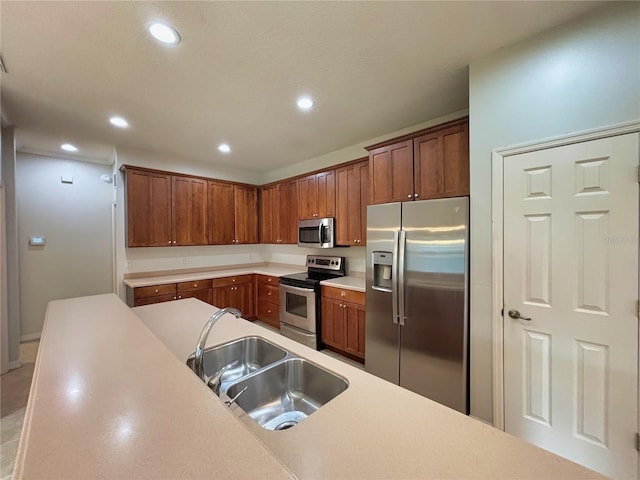 kitchen with sink and appliances with stainless steel finishes