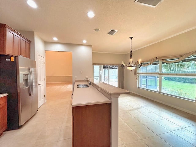 kitchen featuring an inviting chandelier, sink, stainless steel fridge with ice dispenser, ornamental molding, and light tile patterned floors