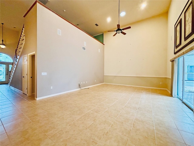 unfurnished living room with high vaulted ceiling, light tile patterned floors, and ceiling fan