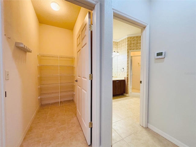 hallway with light tile patterned floors