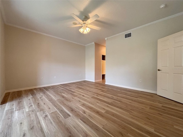 unfurnished room with ceiling fan, hardwood / wood-style flooring, and ornamental molding