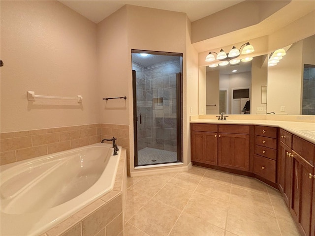 bathroom with vanity, tile patterned floors, and independent shower and bath