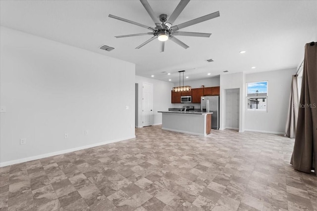 unfurnished living room with ceiling fan