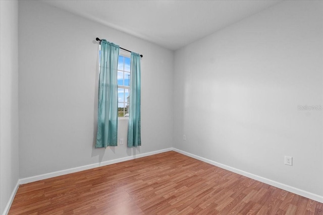 empty room featuring hardwood / wood-style flooring