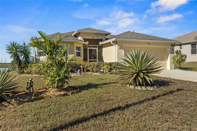 view of front of house with a front lawn and a garage