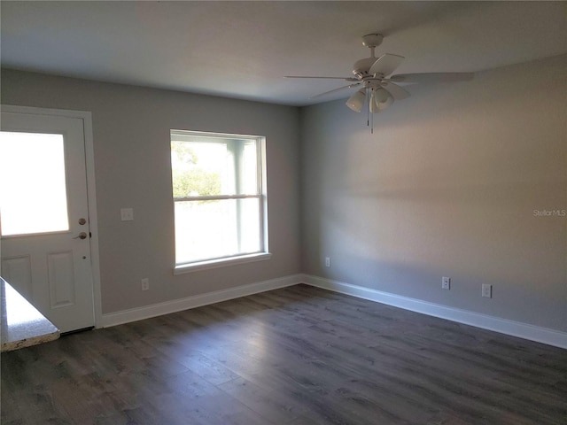 foyer with ceiling fan and dark hardwood / wood-style flooring