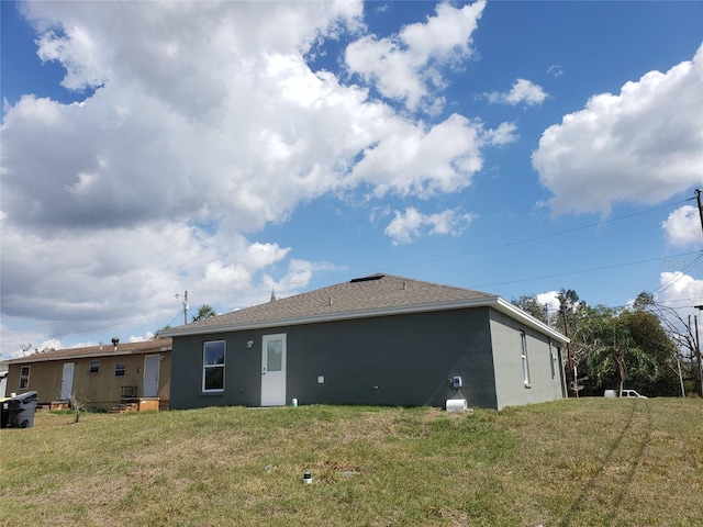 back of house with a yard