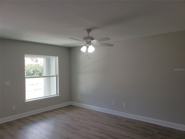 spare room featuring ceiling fan and hardwood / wood-style floors