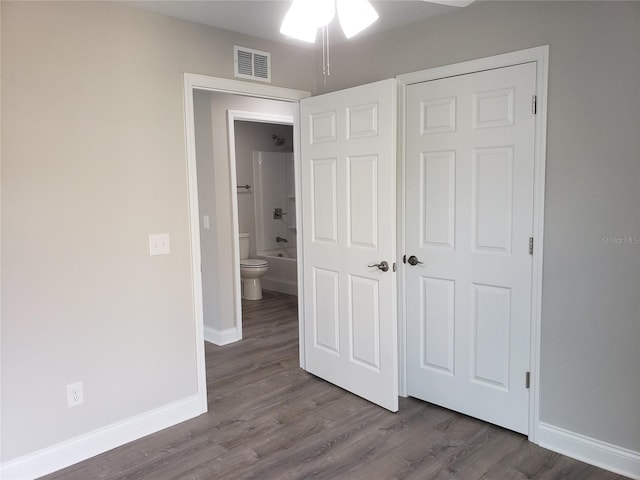 unfurnished bedroom featuring hardwood / wood-style flooring