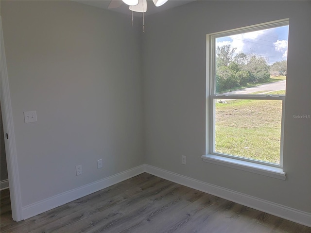 unfurnished room featuring dark hardwood / wood-style flooring