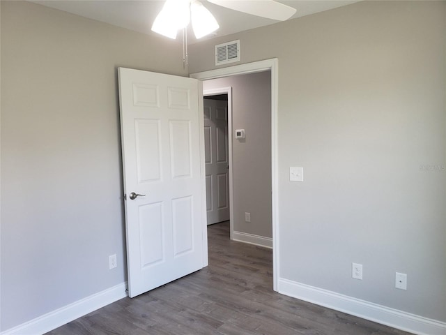 unfurnished bedroom featuring hardwood / wood-style flooring