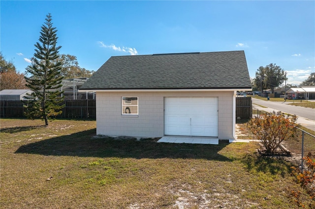 garage featuring a yard