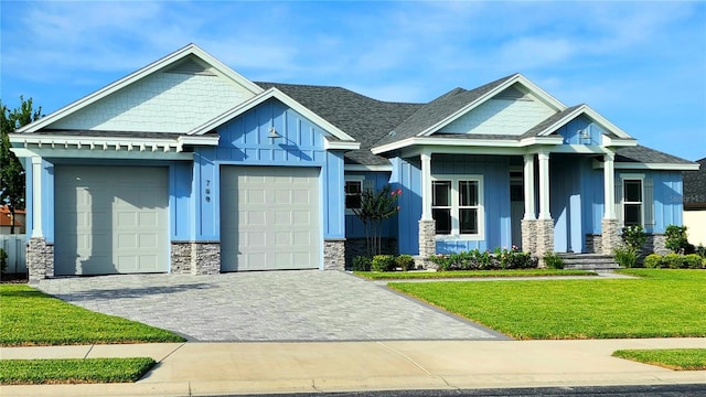 craftsman-style home with a front yard and a garage