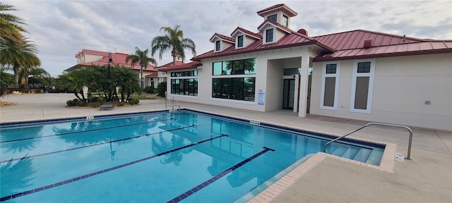 view of pool featuring a patio area