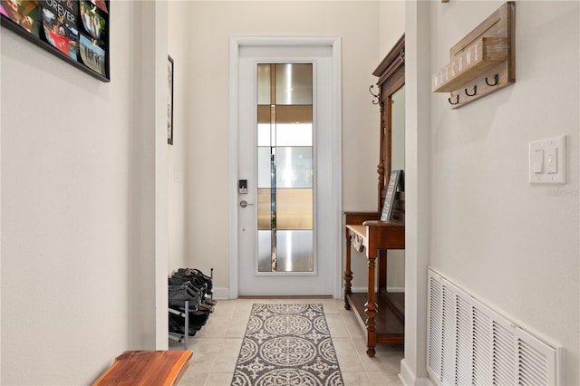 doorway to outside featuring light tile patterned floors