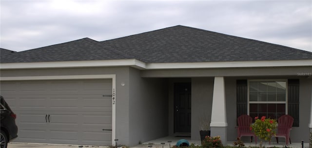 ranch-style house featuring a garage