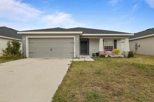 single story home with a garage, covered porch, and a front yard