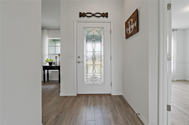 foyer entrance with light wood-type flooring