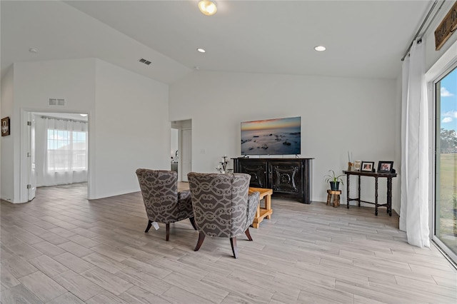 dining space with vaulted ceiling and a wealth of natural light