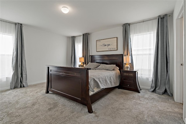 bedroom with light carpet