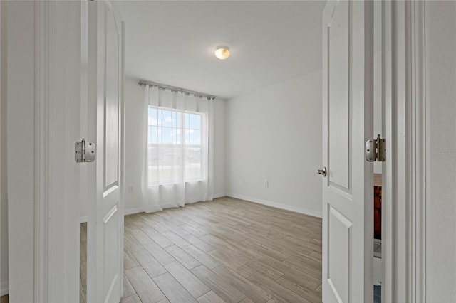 unfurnished room featuring light hardwood / wood-style flooring