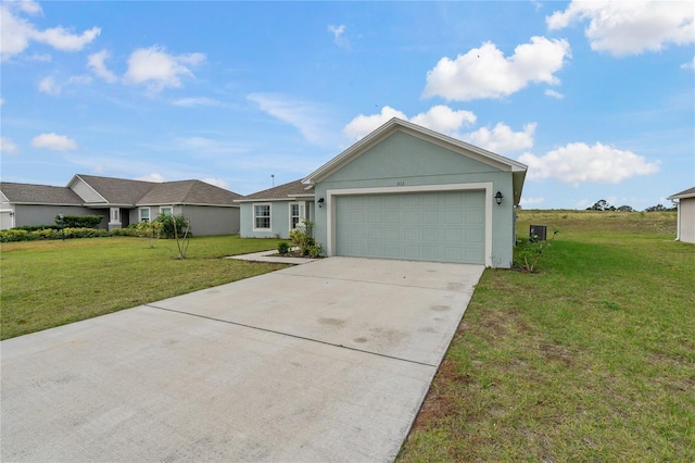 ranch-style house featuring a garage and a front lawn