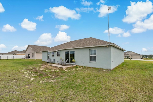 back of property with a patio and a yard