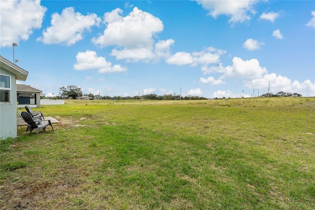 view of yard with a rural view