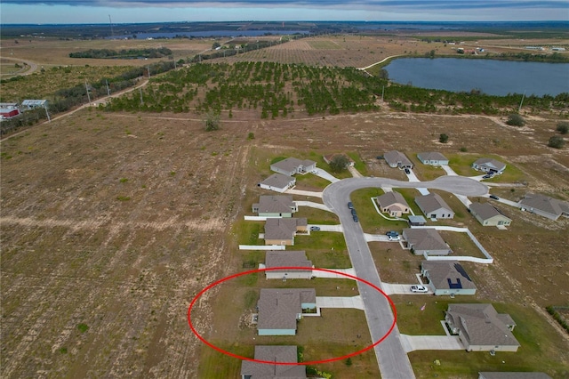 aerial view featuring a water view and a rural view