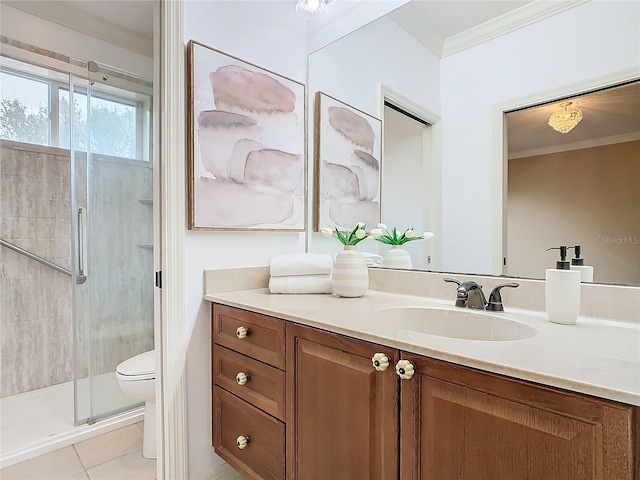 bathroom with toilet, vanity, tile patterned floors, a shower with shower door, and ornamental molding