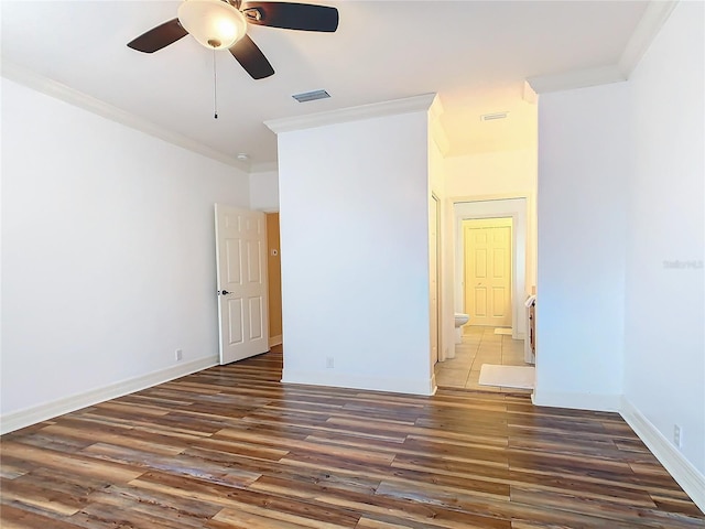 unfurnished room with ceiling fan, ornamental molding, and dark hardwood / wood-style floors