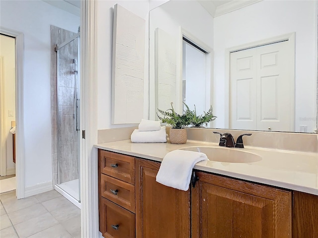 bathroom with crown molding, tile patterned flooring, a shower with door, and vanity