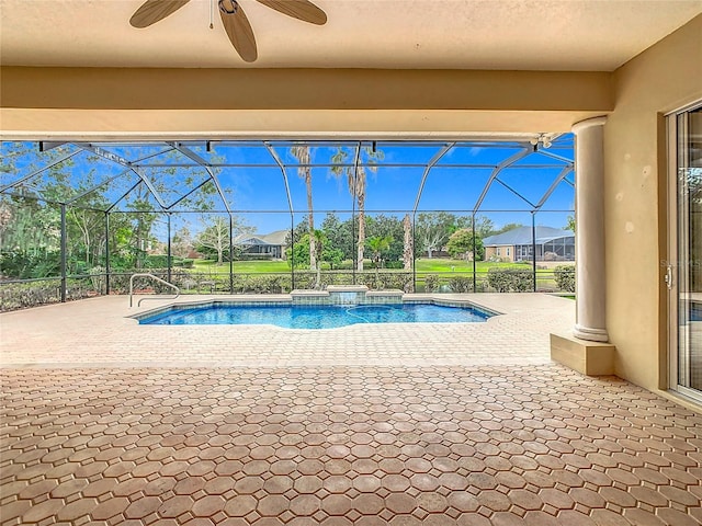 view of swimming pool featuring a lanai, ceiling fan, and a patio