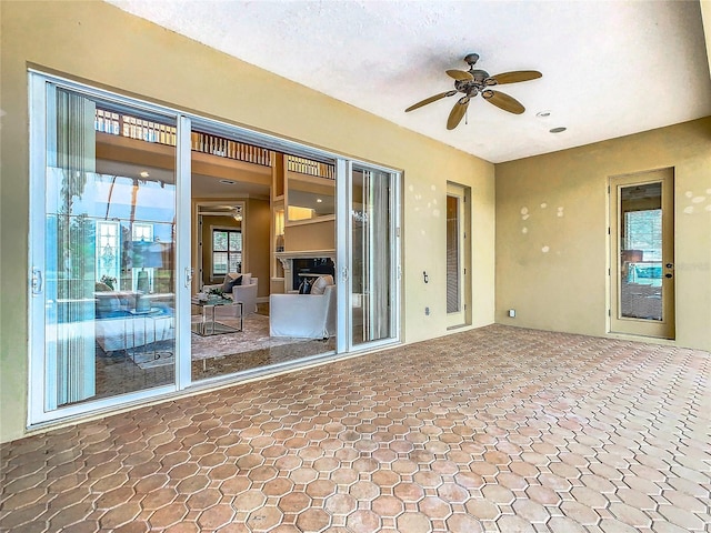 view of patio with ceiling fan